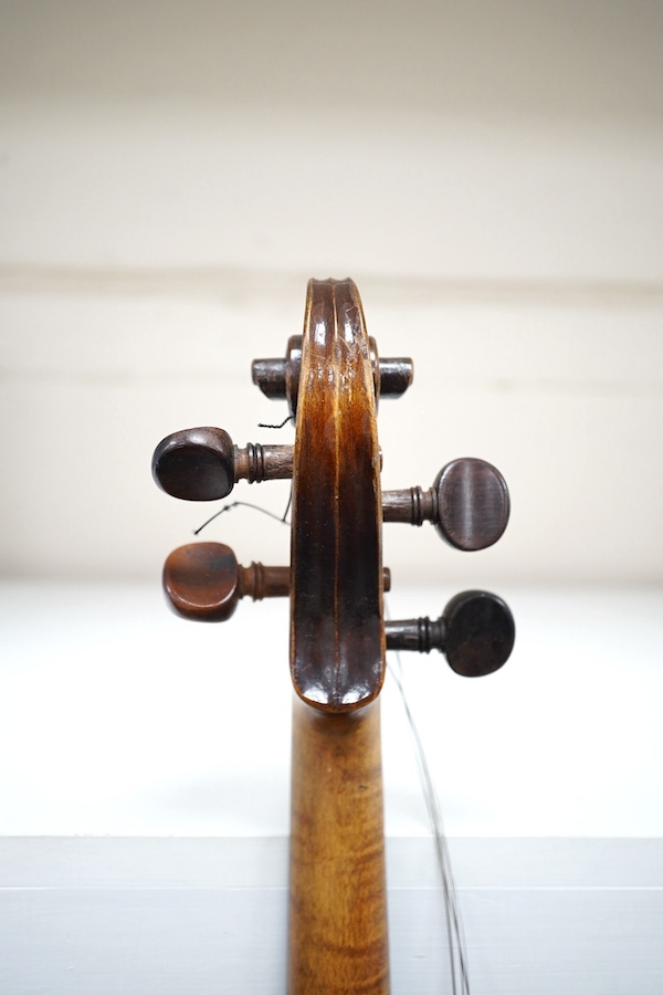 A cased violin, possibly German, body 35.5cm, in a good wooden case with canvas outer cover. Condition - fair